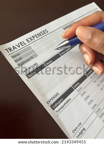 A concept image of a Black person completing a travel expense form Royalty-Free Stock Photo #2143349455