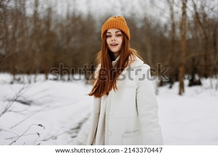 portrait of a woman Walk in winter field landscape outdoor entertainment winter holidays