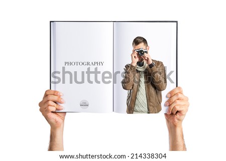Man photographing printed on book