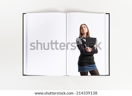 Young student thinking printed on book