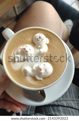 A cup of cocoa and walrus-shaped marshmallows. Breakfast. High quality photo
