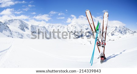 Skiing, winter season , mountains and ski equipments on ski run 