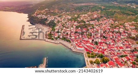 Aerial landscape photography. Panoramic summer view from flying drone of Pylos town, Greece, Europe. Stunning morning sunrise on Ionina seascape, Peloponnese peninsula.