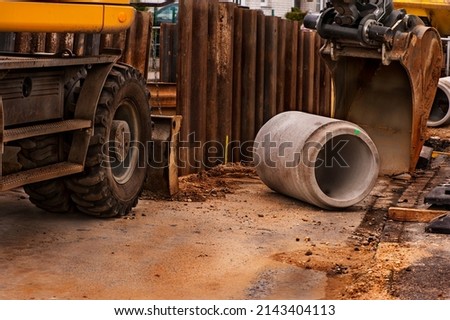 Big pipe or tube for water sewer on construction site during road repair