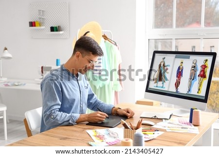Male fashion designer working in studio