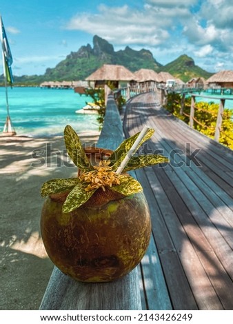 View of the Mount Otemanu through turquoise lagoon, palm trees, overwater bungalows, tropical flowers and a pool on Bora Bora island, Tahiti, French Polynesia, South Pacific Royalty-Free Stock Photo #2143426249