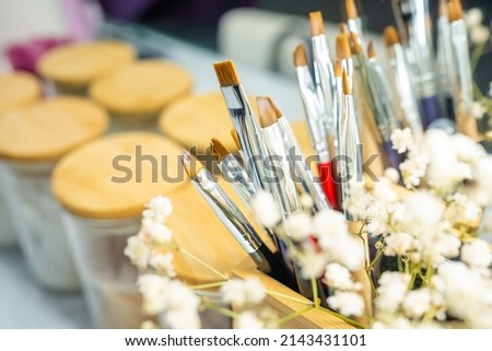 Professional makeup brushes in tube. Master work place . High quality photo