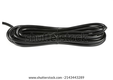Black cable skein on white background. High resolution photo. Full depth of field.