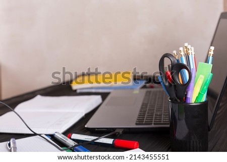 freelancer workplace with laptop and smartphone on wooden kitchen table. copy space