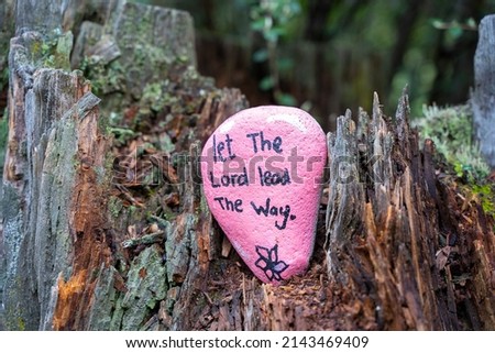 Let the Lord lead the way quote. Motivational religious message of faith. Pink pebble art in nature with Christian words of encouragement and guidance. Royalty-Free Stock Photo #2143469409