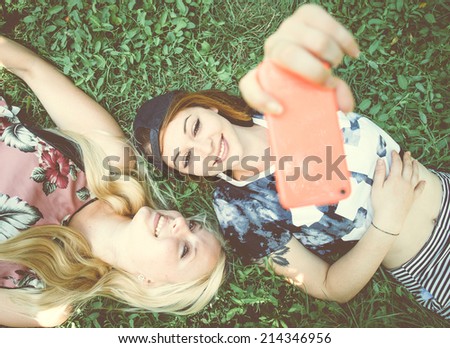 Two pretty girls taking a self portrait