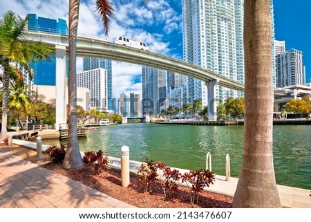 Miami downtown skyline and futuristic mover train above Miami river view, Florida state, United States of America
