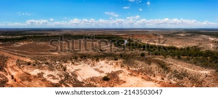 Darling river basin with bended watercourse of main stream in red soil australian outback near Wilcannia town - aerial panorama. Royalty-Free Stock Photo #2143503047