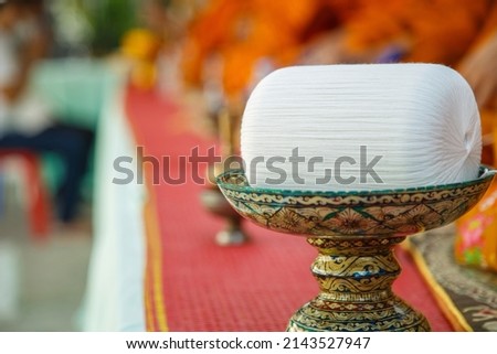 The holy thread on the pedestal linked to the monks during Buddhist rituals.