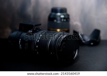 Telephoto lens for DSLR cameras on black, isolated.