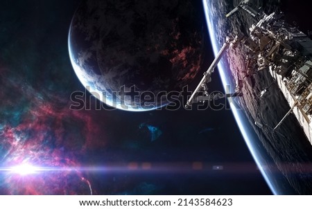 Orbital space station, deep space planets on background of bright star. Science fiction. Elements of this image furnished by NASA