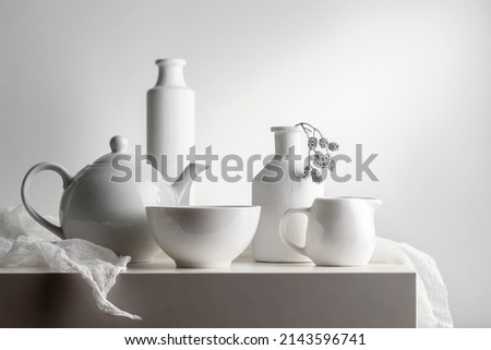 White still life with white dishes on a white background. Royalty-Free Stock Photo #2143596741