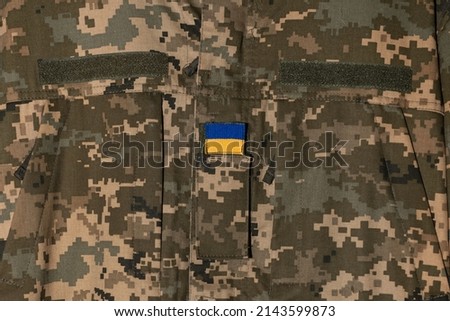 Ukrainian soldier wearing military uniform with flag Ukrainian