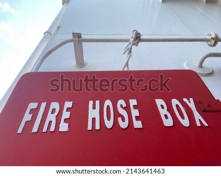 The fire hose box is red. box to put the water hose used for fire fighting on the ship. Fire fighting equipment