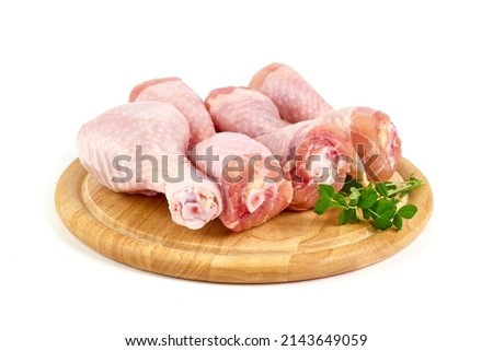 Raw chicken drumsticks, isolated on white background Royalty-Free Stock Photo #2143649059