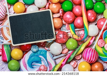 blackboard for writing greetings on a lollipop and sweets