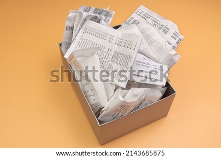 An Overflowing Box of Receipts Ready for Accounting, Bookkeeping, or tax filing Royalty-Free Stock Photo #2143685875