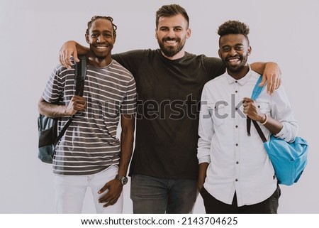 A photo of a group of happy students isolated on white background.