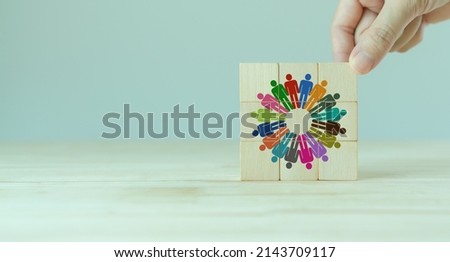 Team building and diversity concept. Work collaboration for achieving goal and successful business. Productive people skills. Hand placed wooden cubes with team diversity building icons. HRM Banner. Royalty-Free Stock Photo #2143709117
