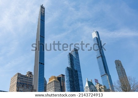 New York city, USA - April 2nd 2022: Steinway tower with Central park tower and other buildings at Manhattan.  Low angle view from central park. Royalty-Free Stock Photo #2143724913