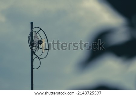 Circle model television antenna isolated from the sky.