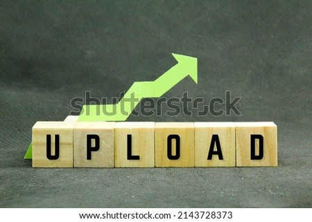 arrows and wooden cubes with the word upload