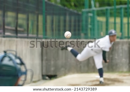 White pitches thrown by a pitcher taking pitching practice to warm up his shoulder in the bullpen during a baseball game. Royalty-Free Stock Photo #2143729389
