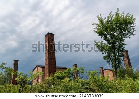 The abandoned Cheltenham Brickworks is seen north of Toronto, Ontario, against a backdrop of a gloomy sky.