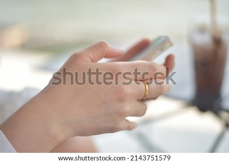 Close up Hand women using smartphone.