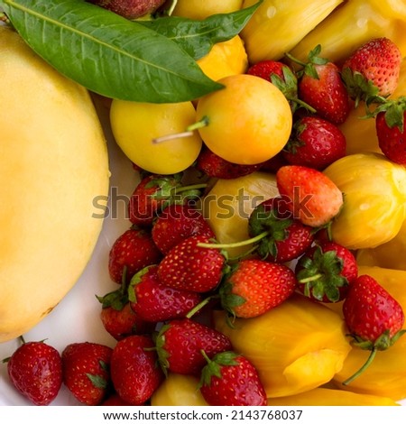 Tropical fruits set background. Mango, plum, strawberry