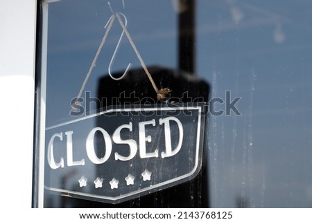 closed boutique text sign board door entrance on windows shop restaurant cafe store signboard