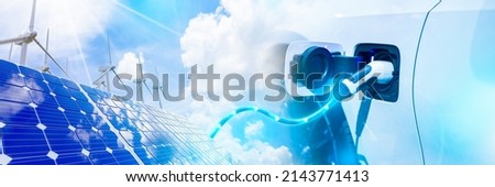EV charging station for electric car concept. solar cell plant and wind generators in urban area connected to smart grid. Energy supply, wind turbine, distribution of energy, Powerplant, energy transmission Royalty-Free Stock Photo #2143771413