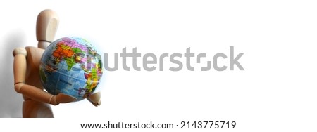 Wide banner wooden human figure holding globe planet Earth on isolated white background