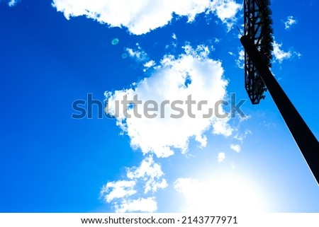 Baseball field, blue sky and lighting