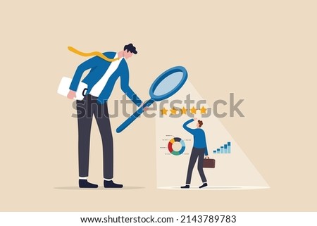 Employee performance evaluation, appraisal or annual review for goals achievement, assessment for rating or feedback concept, businessman manager use magnifier to analyze employee with 5 stars rating. Royalty-Free Stock Photo #2143789783