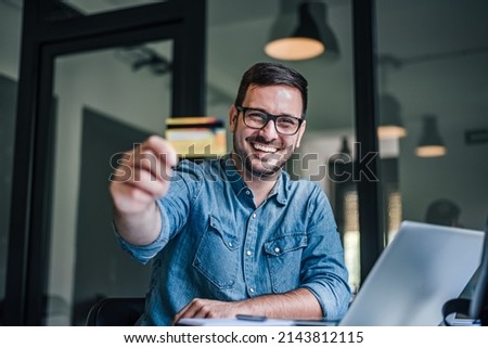 Picture of lovely adult man, giving a special offer for the credit card.