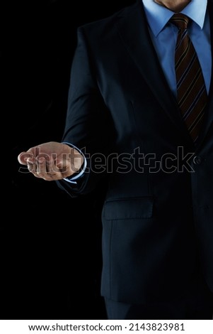 Leading you to business success. Shot of an unrecognizable businessman holding out his hand.