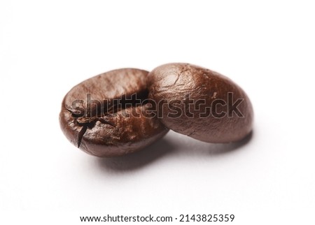 Keep calm and drink coffee. Studio shot of coffee beans against a white background.