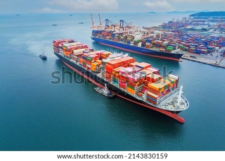 Arial view by drone camera transportation logistics and container dock cargo yard with working crane bridge in shipyard with transport logistic import export with blue sky background. Royalty-Free Stock Photo #2143830159