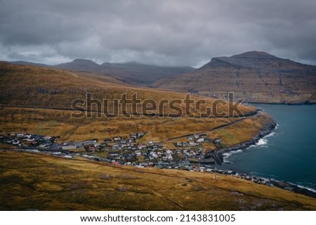 Kvivik village on Streymoy island at the Faroe Islands. Panoramic view, aerial drone shot. November 2021