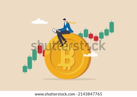 Bitcoin and cryptocurrency investing, crypto trading make profit and earning from Bitcoin price, businessman investor using computer to trade crypto on big Bitcoin with candlestick price graph chart. Royalty-Free Stock Photo #2143847765