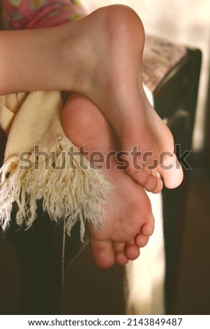 Morning at home. Bare foot close up. Soft focus and cinematic style