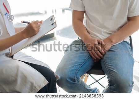 Doctors are discussing prostate cancer and venereal disease detected in young men. Royalty-Free Stock Photo #2143858593