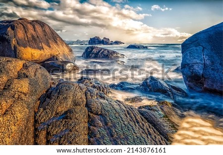 Sea waves near the rocky shore. Boulders beach at sea. Sea boulders beach. Boulders seaview Royalty-Free Stock Photo #2143876161
