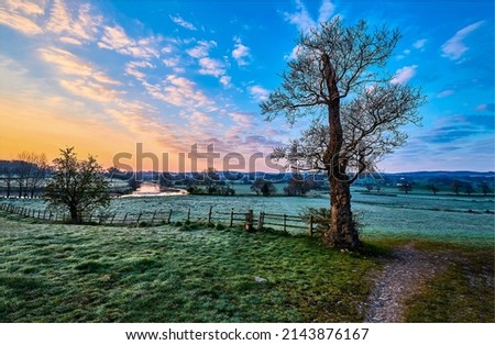 Rural area in the early morning at dawn. Nature in early morning at dawn. Rural country nature at dawn. Beautiful sunrise in countryside at dawn Royalty-Free Stock Photo #2143876167